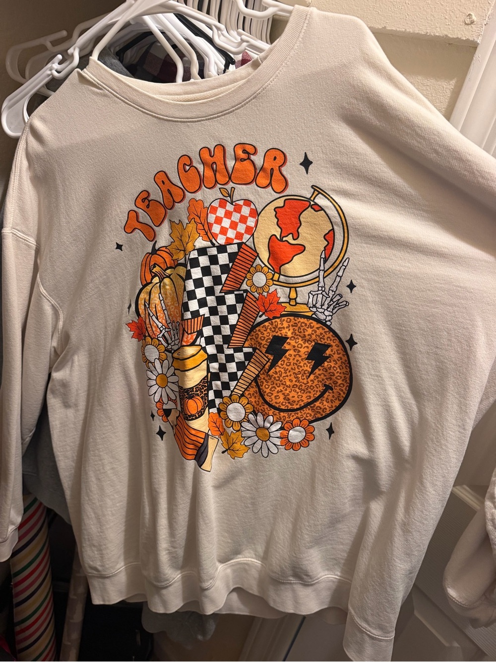 Comfort Colors Cream Teacher Graphic Sweatshirt with Orange and Black Design